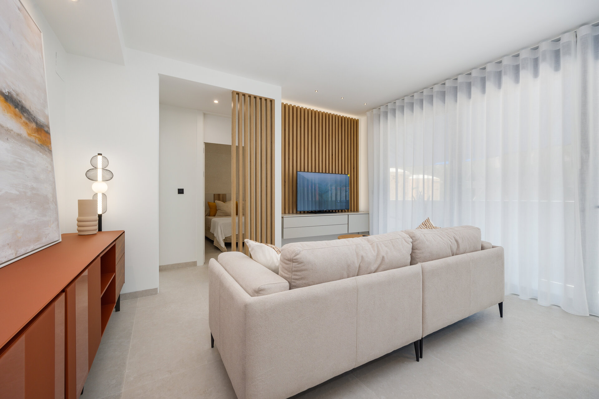 Dunara Resort — show home living room with sofa and TV