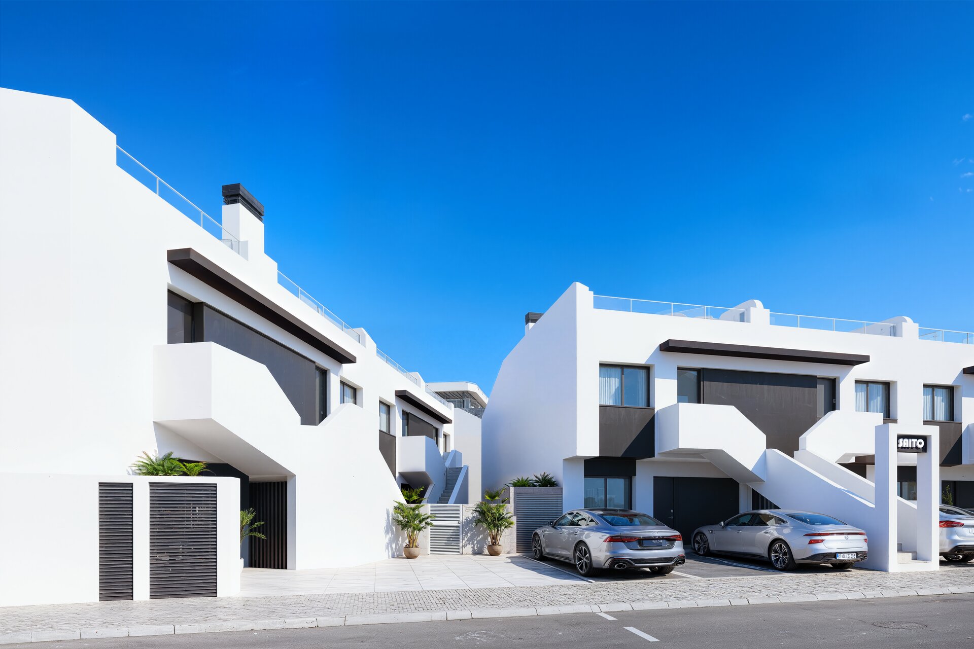 Residencial Saito — building entrance and parking render