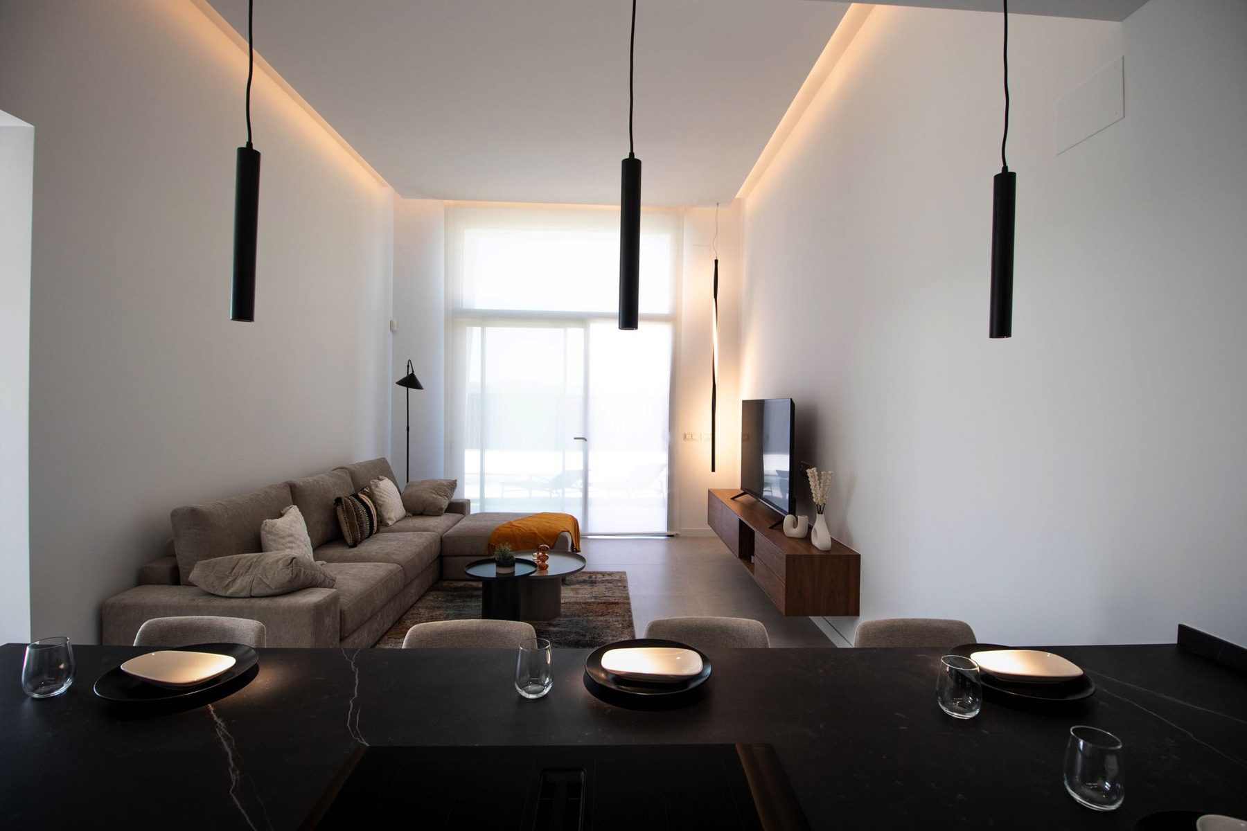 Open-plan living and dining with double-height ceiling