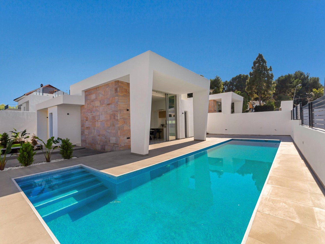 Sunrise Hills — real photo, pool and facade, blue sky